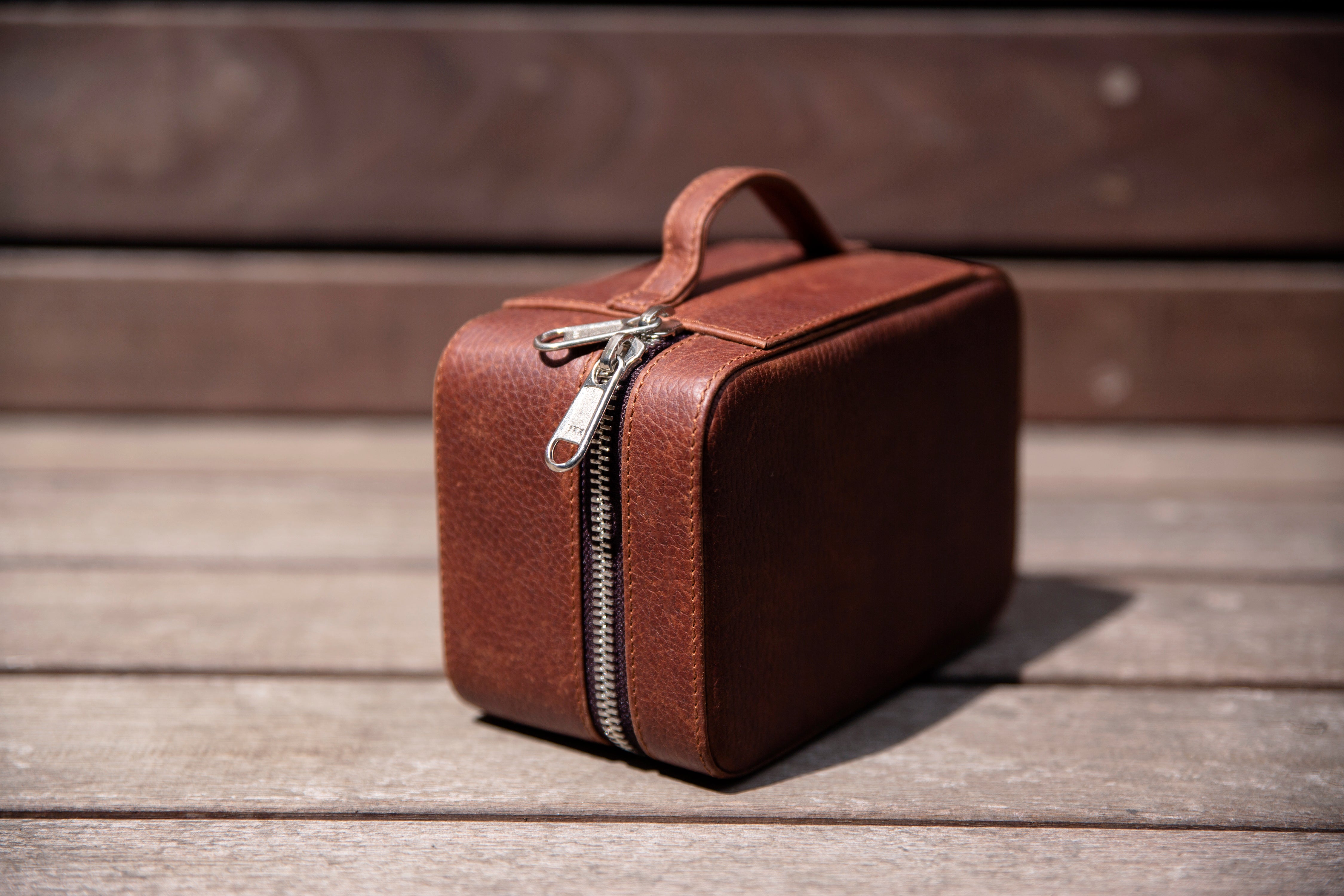 2 watches stored safely in the watch wallet. A leather travel case for watches