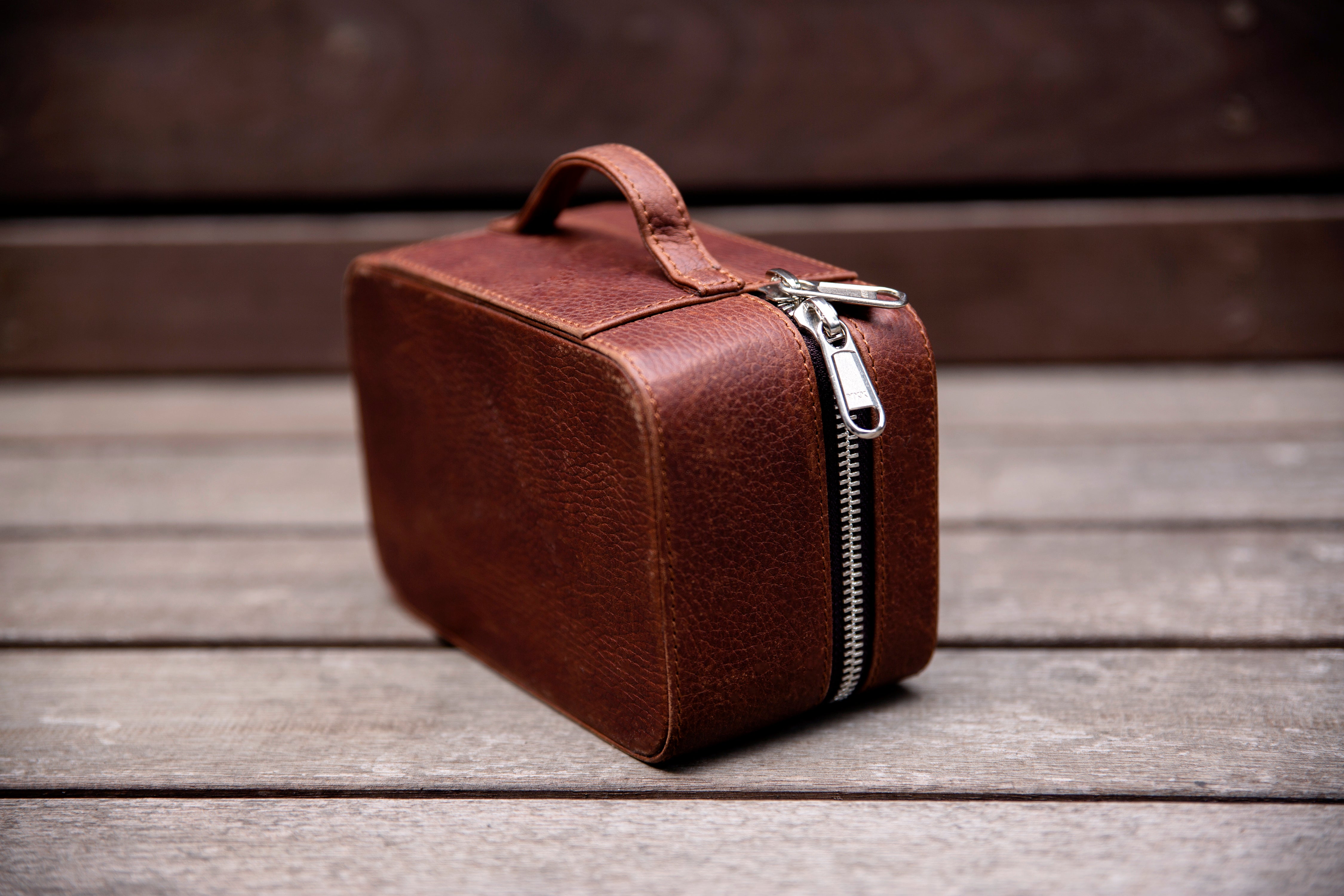 2 watches stored safely in the watch wallet. A leather travel case for watches