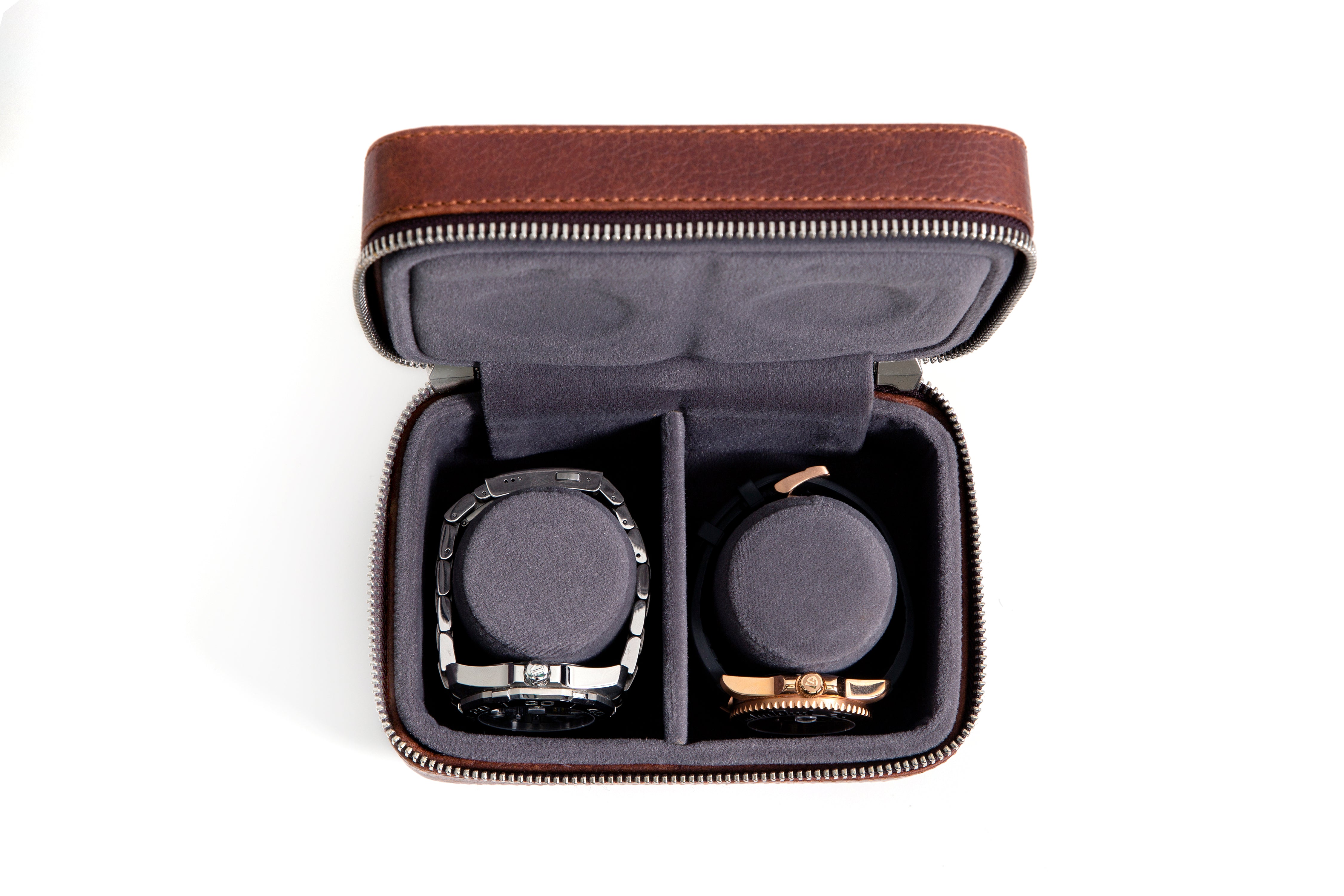 2 watches stored safely in the watch wallet. A leather travel case for watches