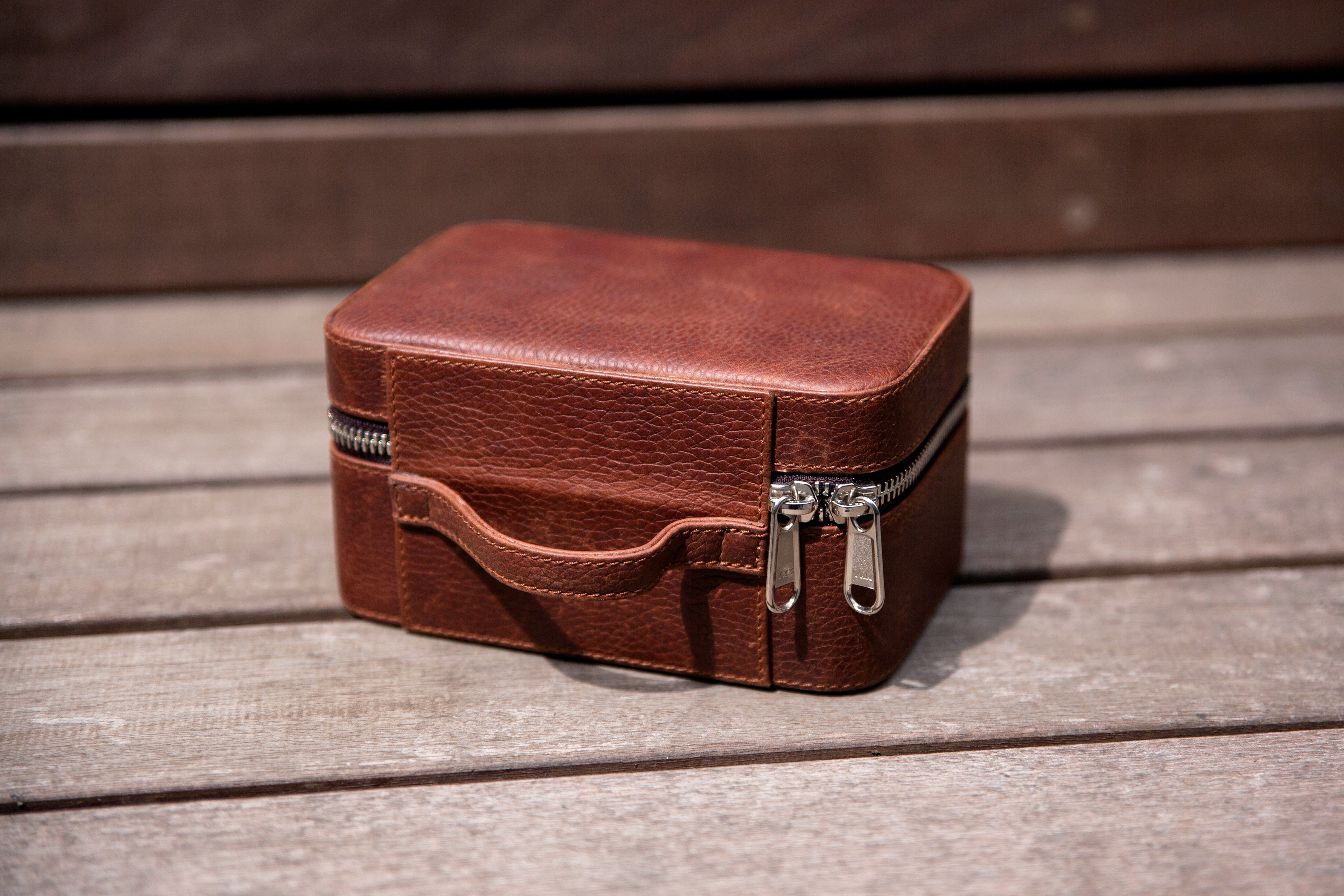 2 watches stored safely in the watch wallet. A leather travel case for watches